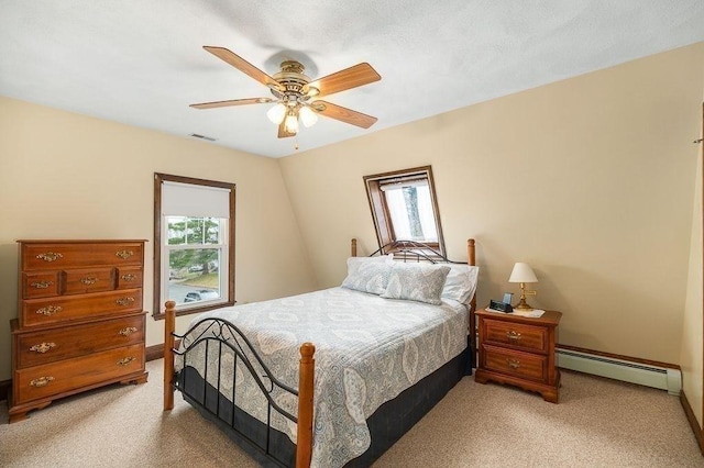 bedroom featuring multiple windows, a baseboard radiator, and light colored carpet