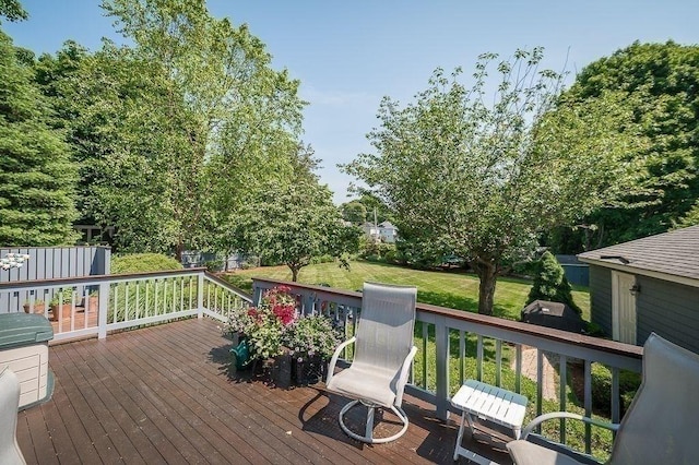 deck featuring a lawn