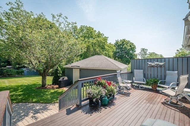 wooden terrace with a lawn