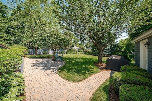 view of yard featuring a patio area and fence
