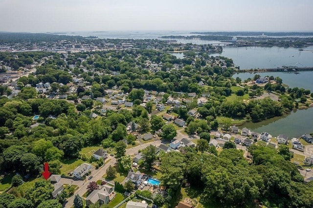 drone / aerial view with a water view and a residential view