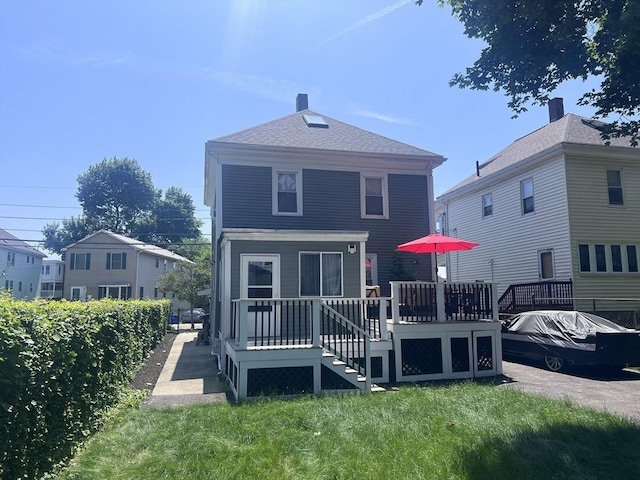 81 Rockdale St, Boston, MA 02126 - rear view of house featuring a wooden deck