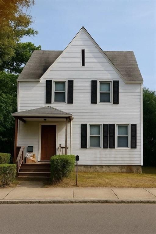 69 Hopedale St, Boston, MA 02134 - view of front of home featuring roof with shingles and covered porch