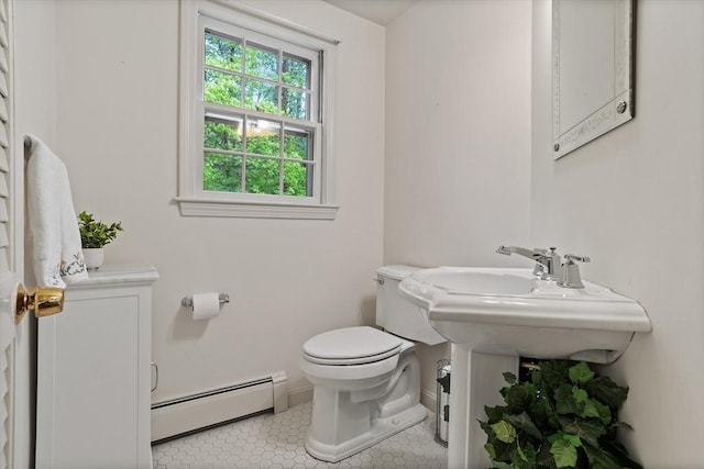 30 Juniper Cir, Concord, MA 01742 - half bath featuring a baseboard radiator, toilet, and baseboards
