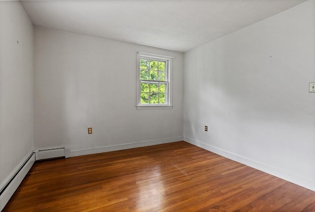30 Juniper Cir, Concord, MA 01742 - unfurnished room with wood-type flooring, baseboard heating, and baseboards