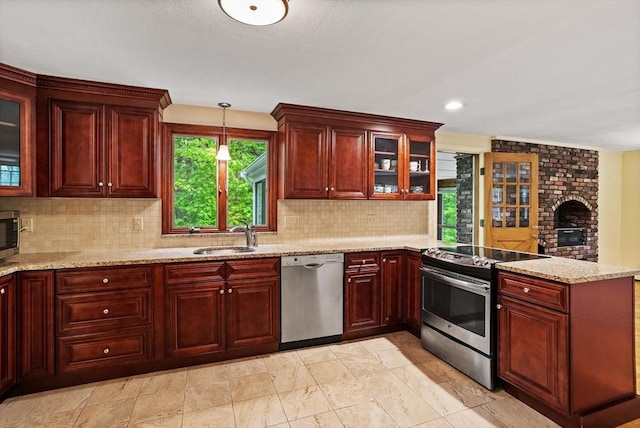 30 Juniper Cir, Concord, MA 01742 - kitchen with stainless steel appliances, a sink, and reddish brown cabinets
