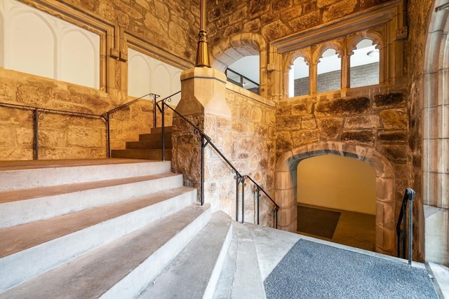 321 Harvard St Unit 302, Cambridge, MA 02139 - staircase featuring arched walkways