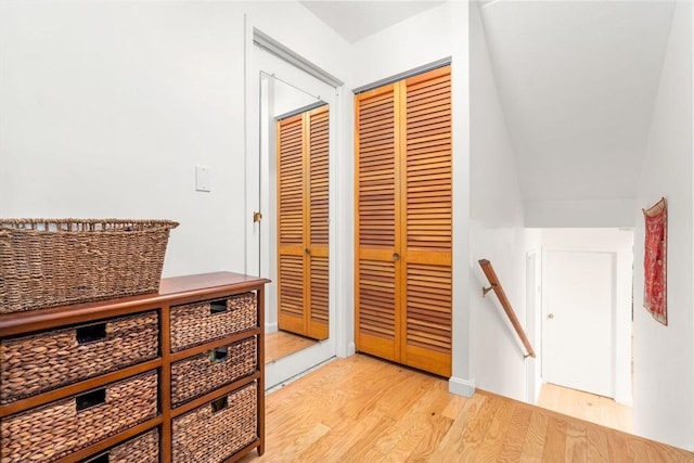 321 Harvard St Unit 302, Cambridge, MA 02139 - hall featuring light wood finished floors and an upstairs landing