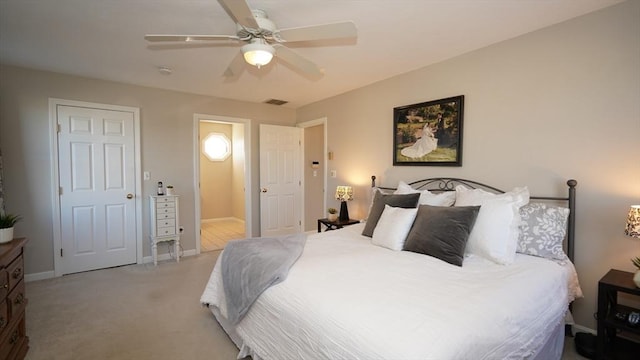 carpeted bedroom featuring ceiling fan