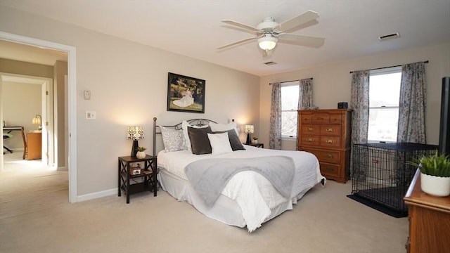 bedroom featuring light carpet and ceiling fan