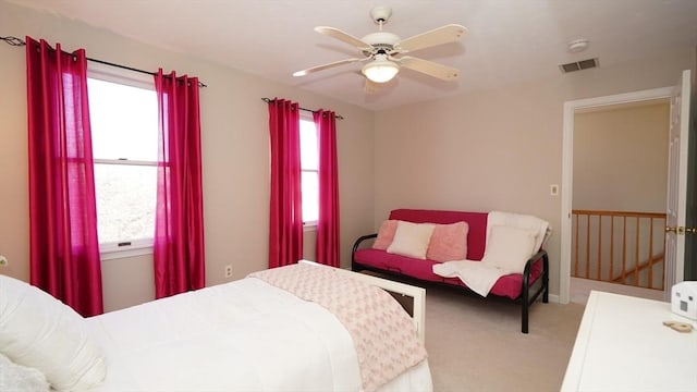 bedroom with light colored carpet and ceiling fan