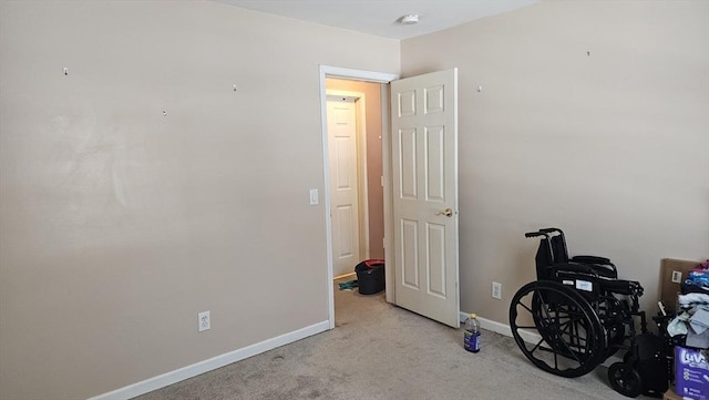 misc room with light colored carpet