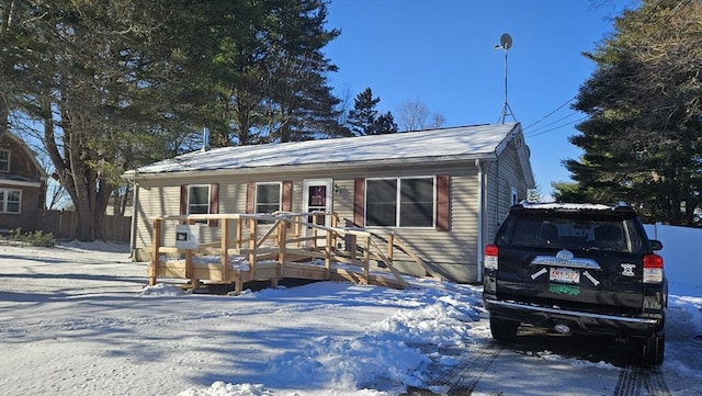 view of front of home with a wooden deck