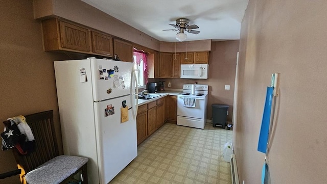 kitchen with ceiling fan, sink, and white appliances