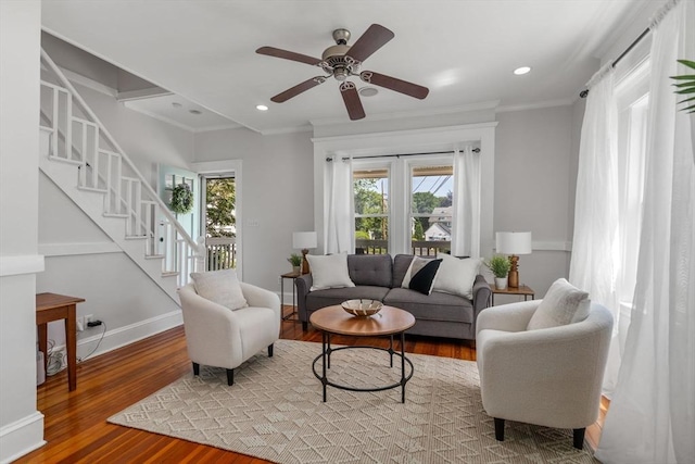 91 Freeman St, Newton, MA 02466 - living room with ornamental molding, wood finished floors, stairs, and a ceiling fan