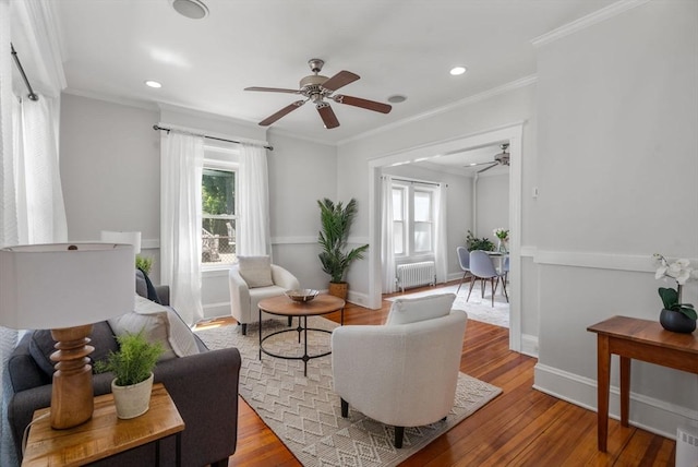 91 Freeman St, Newton, MA 02466 - living room featuring radiator, ceiling fan, wood finished floors, crown molding, and recessed lighting