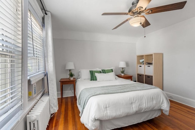 91 Freeman St, Newton, MA 02466 - bedroom featuring radiator heating unit, wood finished floors, ceiling fan, and cooling unit