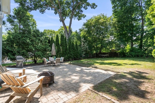 91 Freeman St, Newton, MA 02466 - fenced backyard featuring an outdoor fire pit, a patio, and outdoor dining space