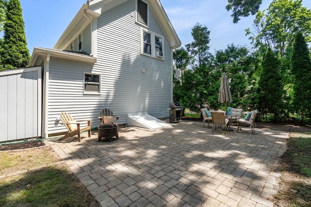 91 Freeman St, Newton, MA 02466 - view of patio featuring outdoor dining area, a fire pit, and area for grilling