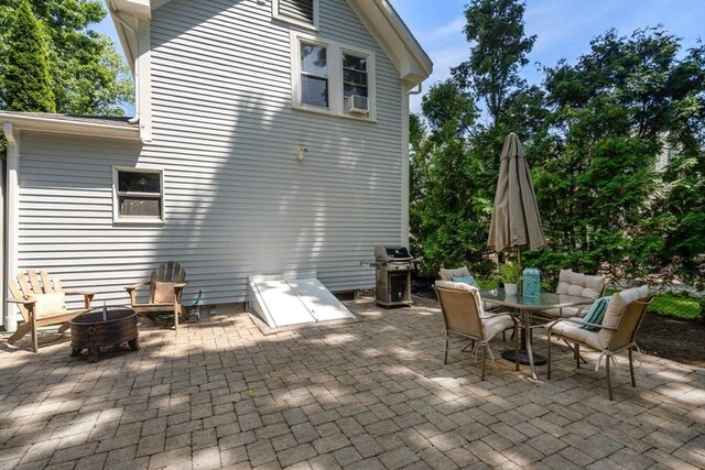 91 Freeman St, Newton, MA 02466 - view of patio / terrace featuring a grill, a fire pit, and outdoor dining space