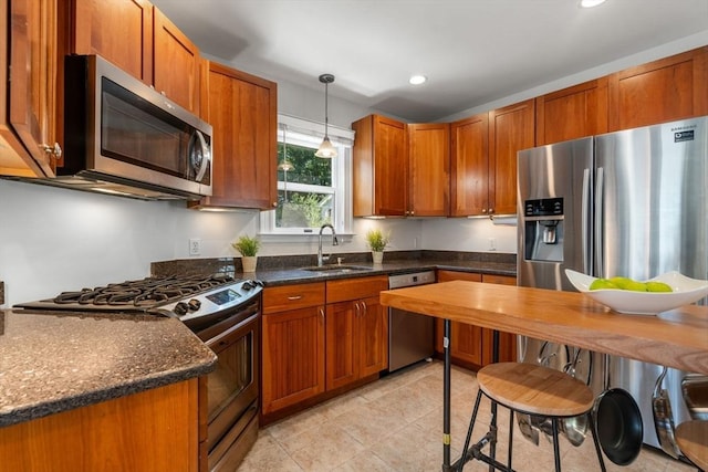 91 Freeman St, Newton, MA 02466 - kitchen featuring stainless steel appliances, hanging light fixtures, recessed lighting, light tile patterned flooring, and brown cabinetry