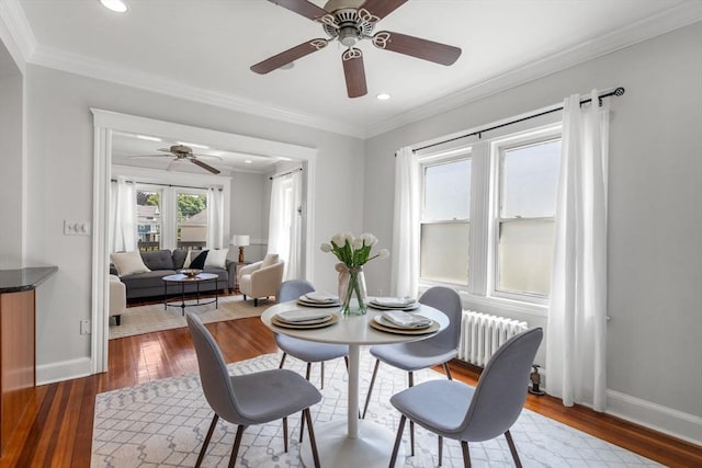 91 Freeman St, Newton, MA 02466 - dining space featuring ceiling fan, radiator, hardwood / wood-style flooring, crown molding, and recessed lighting