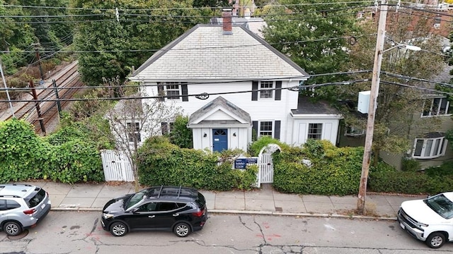 view of front of home featuring a gate, fence, and cooling unit