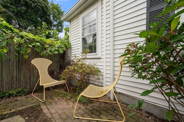 view of patio featuring fence