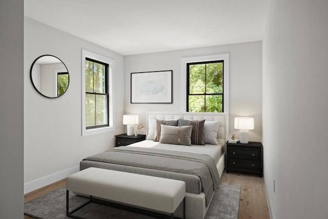 bedroom with hardwood / wood-style flooring