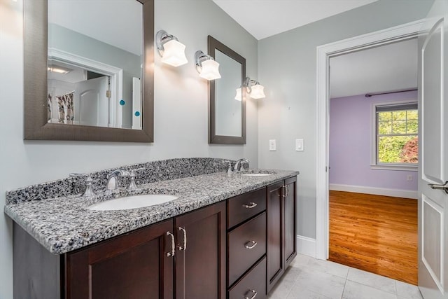 84 Bruce Rd, Concord, MA 01742 - bathroom featuring double vanity and baseboards