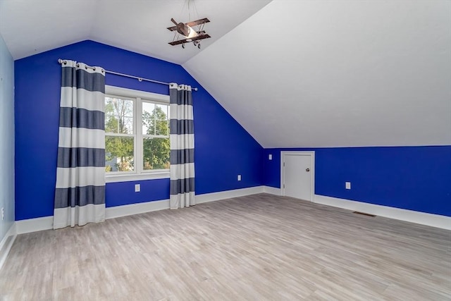 84 Bruce Rd, Concord, MA 01742 - additional living space with lofted ceiling, wood finished floors, baseboards, and a ceiling fan