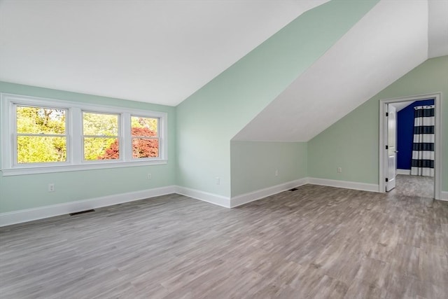 84 Bruce Rd, Concord, MA 01742 - bonus room featuring lofted ceiling, wood finished floors, and baseboards
