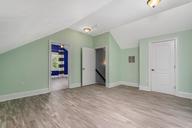 84 Bruce Rd, Concord, MA 01742 - bonus room featuring light wood-style floors, baseboards, and vaulted ceiling
