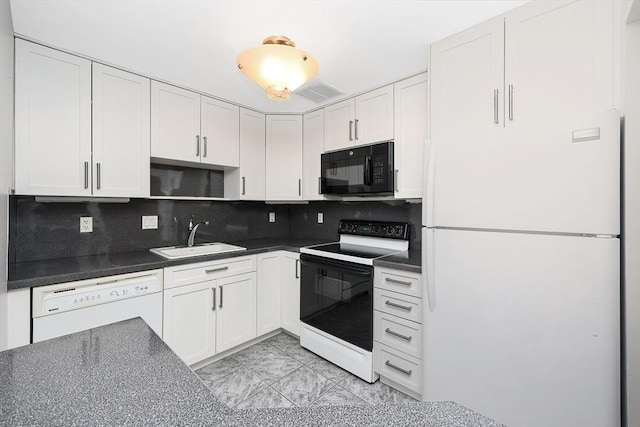 kitchen with sink, white cabinets, and white appliances