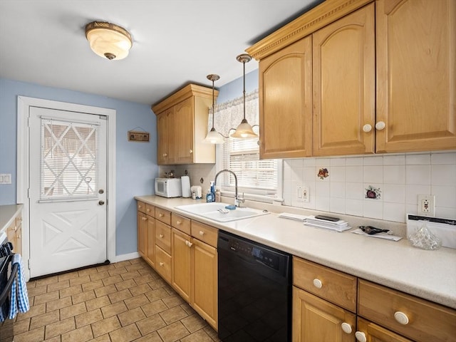 kitchen featuring black dishwasher, decorative backsplash, hanging light fixtures, light countertops, and a sink