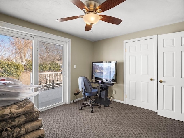 carpeted office featuring ceiling fan and baseboards