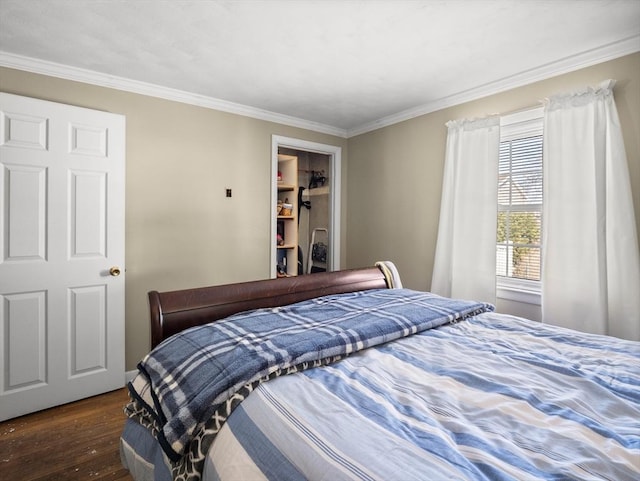 bedroom featuring ornamental molding and dark wood-style flooring