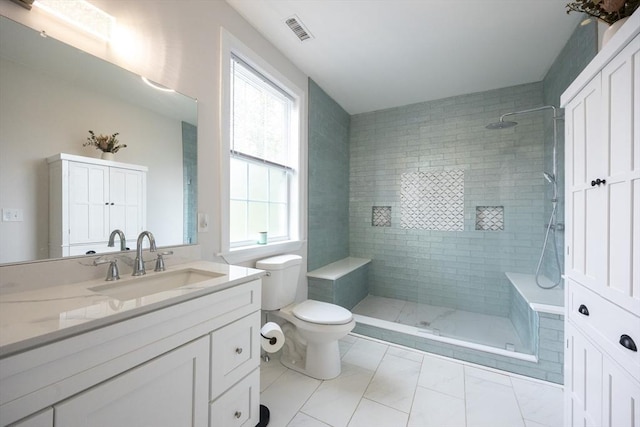 977 E St, Wrentham, MA 02093 - bathroom with vanity, tiled shower, and marble look tile flooring
