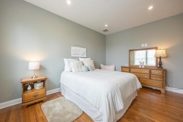 977 E St, Wrentham, MA 02093 - bedroom with wood finished floors and recessed lighting