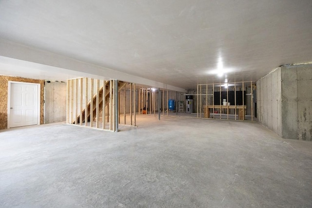977 E St, Wrentham, MA 02093 - unfinished basement featuring stairway and water heater