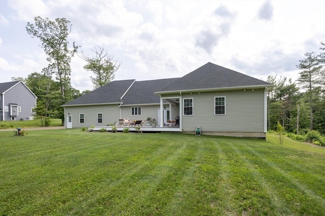 977 E St, Wrentham, MA 02093 - back of property featuring a lawn and a wooden deck