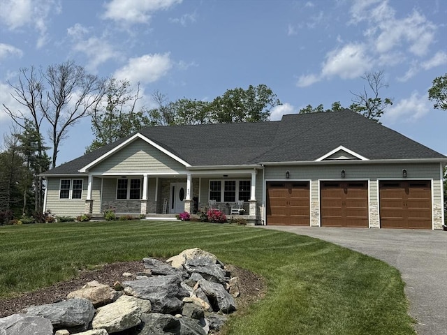 977 E St, Wrentham, MA 02093 - craftsman house with a porch, an attached garage, driveway, a front yard, and stone siding