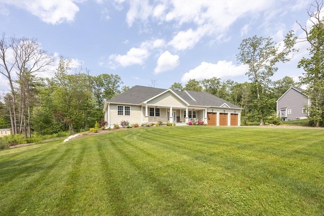 977 E St, Wrentham, MA 02093 - rear view of house with covered porch, a garage, and a yard