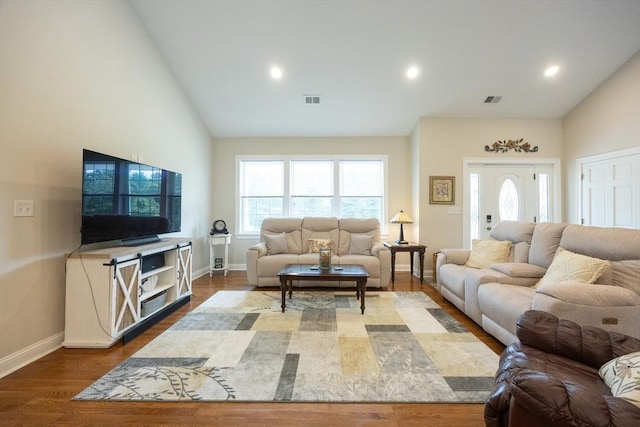 977 E St, Wrentham, MA 02093 - living area with wood finished floors, high vaulted ceiling, and recessed lighting