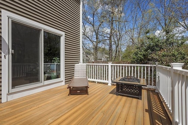deck featuring a fire pit