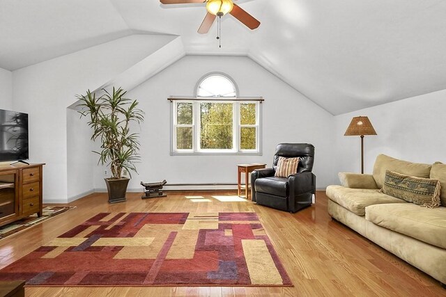 living room featuring a ceiling fan, a baseboard heating unit, light wood-style flooring, and lofted ceiling