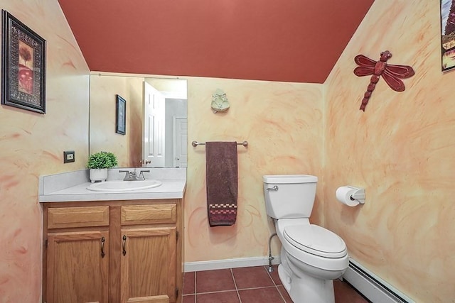 bathroom with vanity, toilet, tile patterned floors, baseboards, and a baseboard radiator