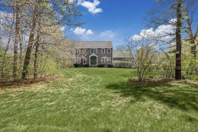 colonial-style house with a front yard