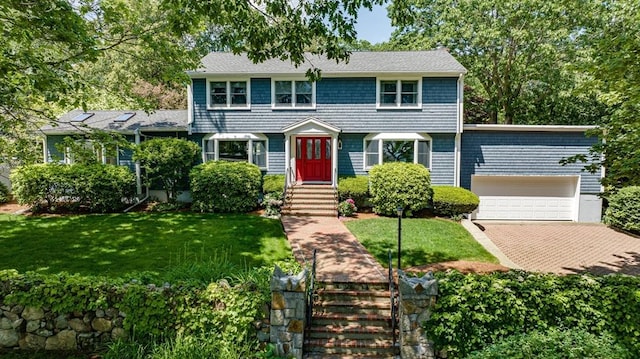 24 Flume Rd, Gloucester, MA 01930 - colonial house with an attached garage, a front lawn, and driveway