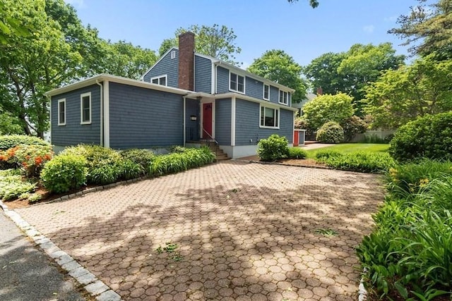 24 Flume Rd, Gloucester, MA 01930 - back of property with a chimney